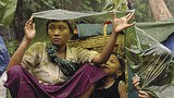 refugees_in_rain_305px.jpg