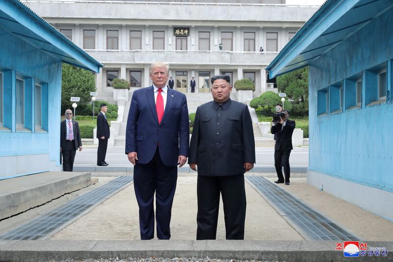 U.S. President Donald Trump and North Korean leader Kim Jong Un pose at a military demarcation line at the demilitarized zone separating the two Koreas, in Panmunjom, South Korea, June 30, 2019.