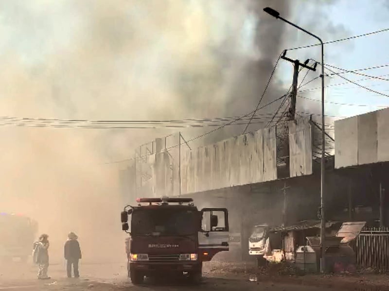 A Chinese auto spare-part shop is consumed by fire, in Nami village, Oudomxay province, Laos, Feb. 14, 2025.
