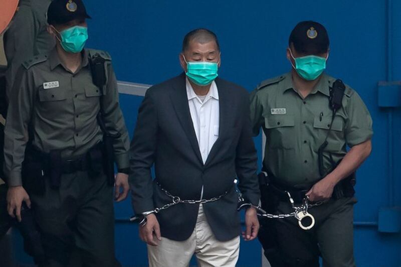 2020年12月,香港媒体大亨黎智英被捕入监服刑。(路透社图片)