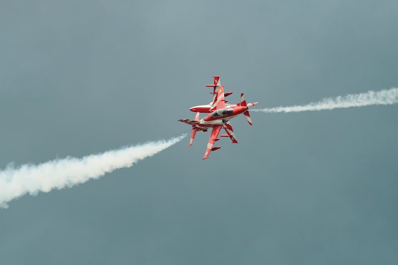 The Indian Air Force Surya Kiran Aerobatic Team flies Hawk Mk-132 jets as it performs over Don Mueang airbase in Bangkok, March 7, 2025.