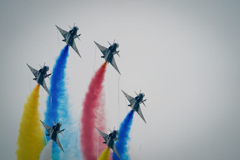 Chinese People’s Liberation Army Air Force Chengdu J-10 jets perform over Don Mueang airbase in Bangkok, March 7, 2025.