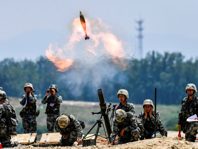 Soldiers of Chinese People's Liberation Army fire a mortar during a live-fire military exercise in Anhui province, China, May 22, 2021. (Reuters)