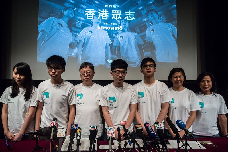香港众志成员黄之锋、罗冠聪及周庭等。（AFP）