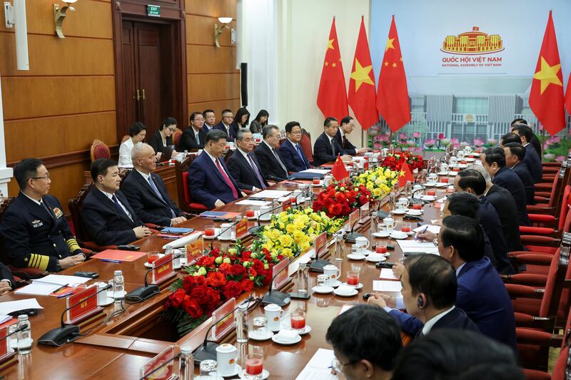 Chinese President Xi Jinping and Foreign Minister Wang Yi attend a meeting with Vietnam's National Assembly Chairman Tran Thanh Man in Hanoi, Vietnam, April 14, 2025.