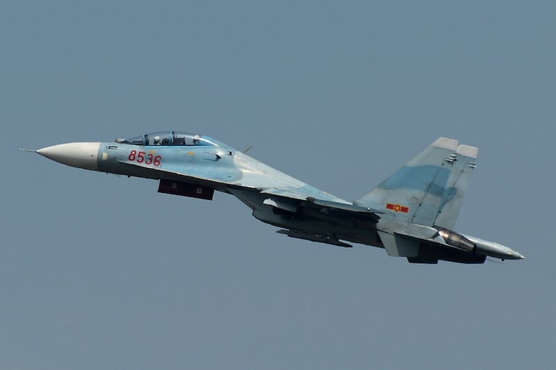 This photograph taken on October 21, 2015 shows a Vietnam Air Force Sukhoi Su-30MK2 multirole fighter aircraft, similar to the jet fighter that disappeared off the Vietnamese coast on June 14, 2016, taking off for a training mission at Bien Hoa military airport in the southern province of Dong Nai. Vietnamese authorities are looking for a missing jet fighter that lost contact while it was flying on a training mission off the country's coastline on June 14, 2016, a senior army officer said. The Russian-made Su-30MK2 was carrying two pilots when it disappeared from radar around 26 nautical miles from northern Nghe An province, state-media reported. (Photo by AFP)