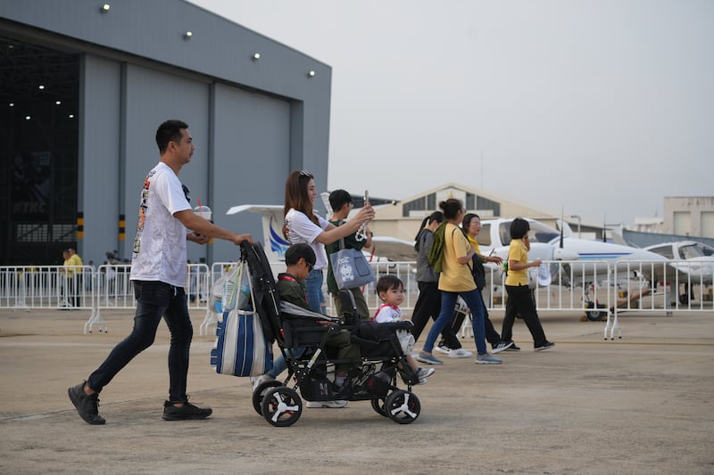 Spectators arrive at Don Mueang airbase for the international air show commemorating the 88th anniversary of the Royal Thai Air Force, March 7, 2025, in Bangkok.