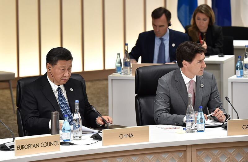 2019年6月29日,加拿大总理特鲁多(右)和中国国家主席习近平在日本大阪出席G20峰会。(路透社)