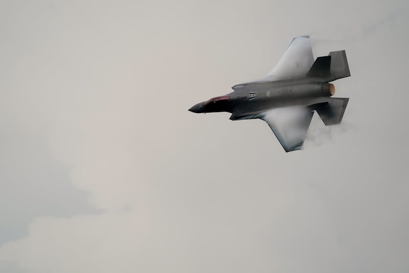 Vortices are visible on its wings as a U.S. Air Force F-35A demonstration team jet performs over Don Mueang airbase in Bangkok, March 7, 2025.