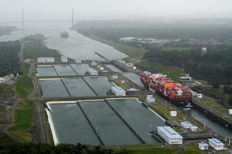 An aerial view shows a cargo vessel transits through the Cocoli Locks at the Panama Canal, in Panama City, Panama, February 1, 2025. REUTERS/Enea Lebrun