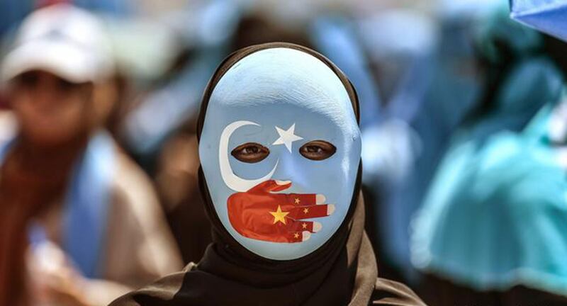 资料图片:海外维吾尔人走上街头,抗议中国政府在新疆的高压政策 。(法新社)