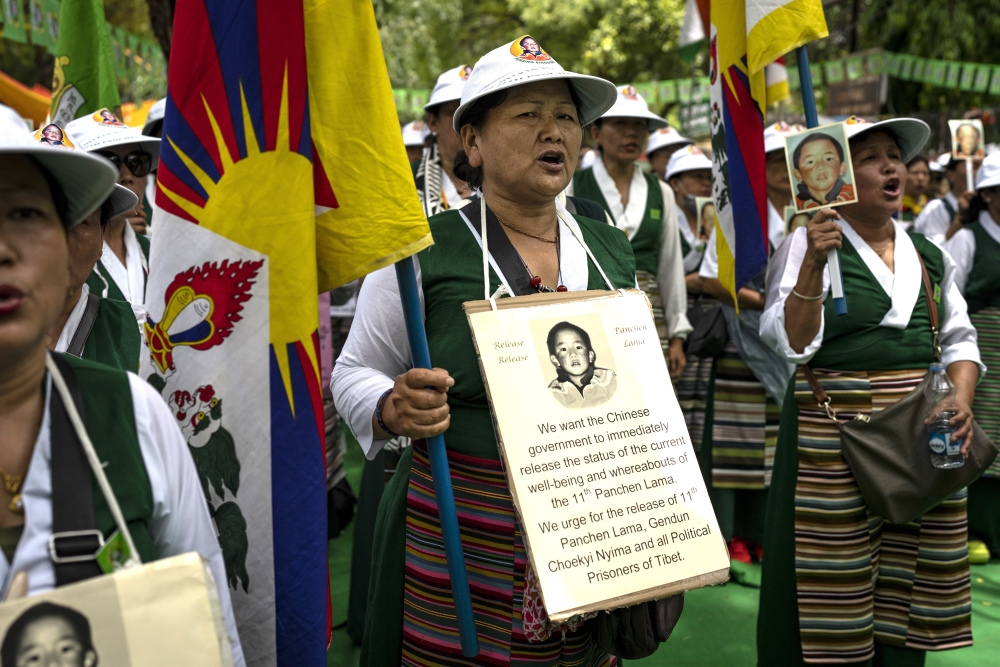 Tibetan Women's Association hold placards and portraits of the 11th Panchen Lama, Gendhun Choekyi Nyima Ap.jpg Tibetan Women's Association hold placards and portraits of the 11th Panchen Lama, Gendhun Choekyi Nyima Ap.jpg